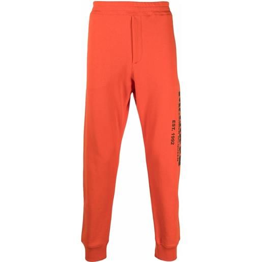 Alexander McQueen pantaloni sportivi con stampa - arancione