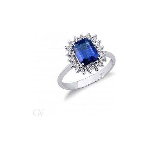 Gioielli di Valenza anello in oro bianco 18k con diamanti a contorno e zaffiro blu