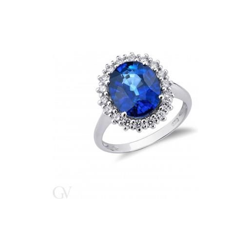 Gioielli di Valenza anello modello contorno in oro bianco 18k con zaffiro blu centrale e diamanti. 