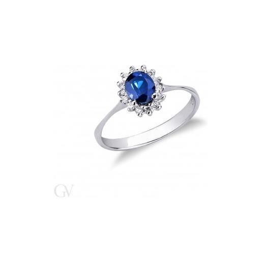 Gioielli di Valenza anello contorno in oro bianco 18k con diamanti e zaffiro blu ovale