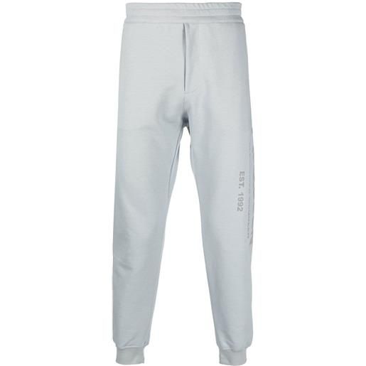 Alexander McQueen pantaloni sportivi con stampa - grigio