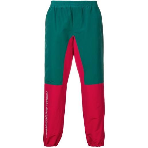 JohnUNDERCOVER pantaloni sportivi con design color block - verde