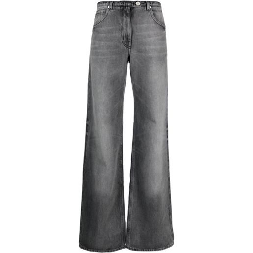 Courrèges jeans a gamba ampia con effetto schiarito - grigio