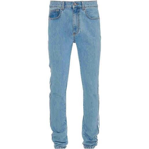 JW Anderson jeans slim con applicazione - blu