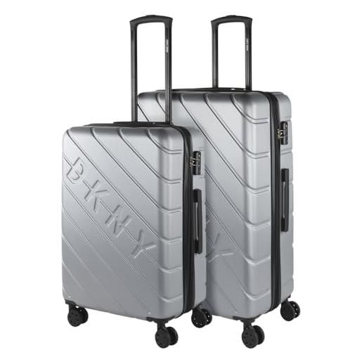 DKNY - set valigie - set valigie rigide offerte. Valigia grande rigida, valigia media rigida e bagaglio a mano. Set di valigie con lucchetto combinazione tsa, argento
