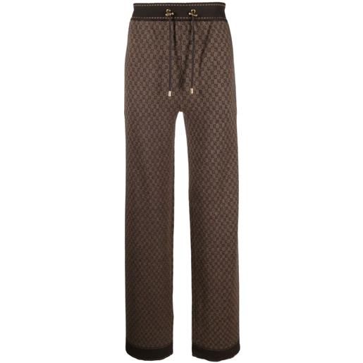 Balmain pantaloni con stampa monogramma - marrone