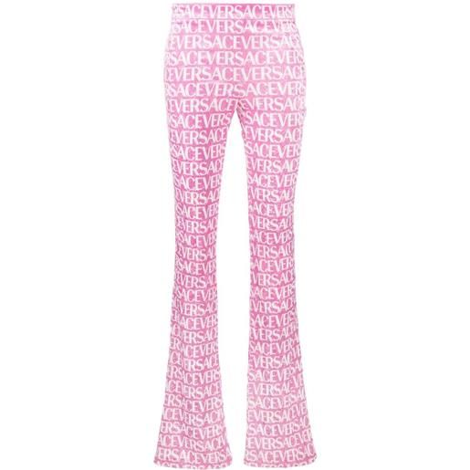 Versace pantaloni svasati con stampa - rosa