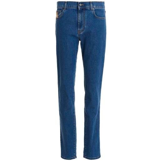 Moschino jeans in denim con logo orsetto