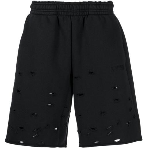 VETEMENTS above-knee ripped track shorts - nero