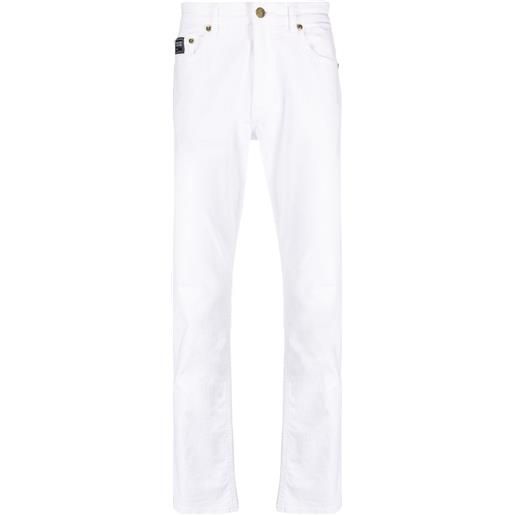 Versace Jeans Couture jeans slim con applicazione - bianco