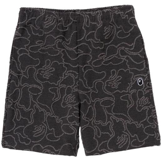 A BATHING APE® shorts sportivi con stampa camouflage - nero