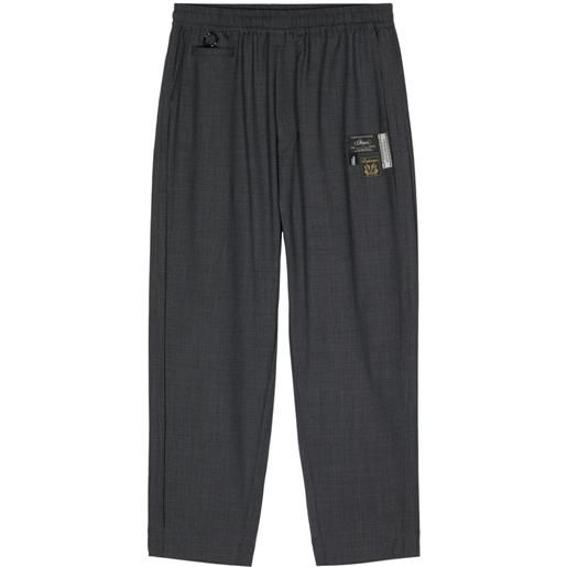Undercover pantaloni dritti con applicazione logo - grigio