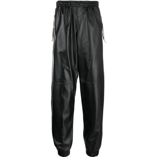 Moschino pantaloni sportivi crop in pelle - nero