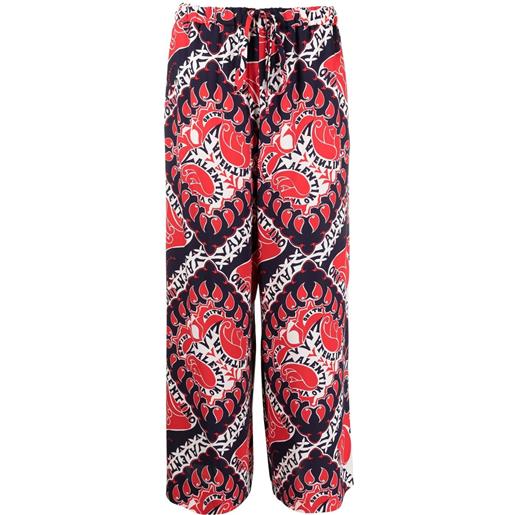 Valentino Garavani pantaloni archive manifesto con stampa - rosso